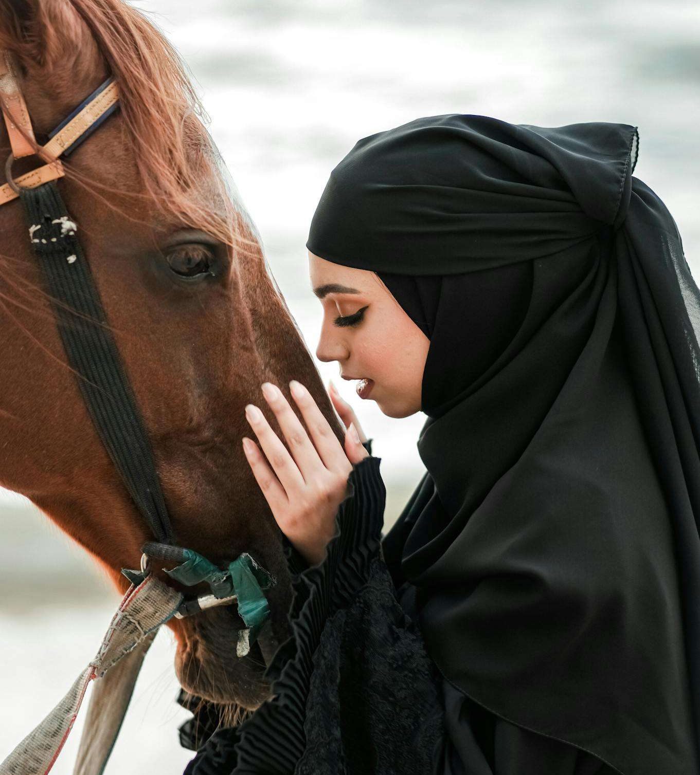 Woman in Hijab and Abaya with Horse